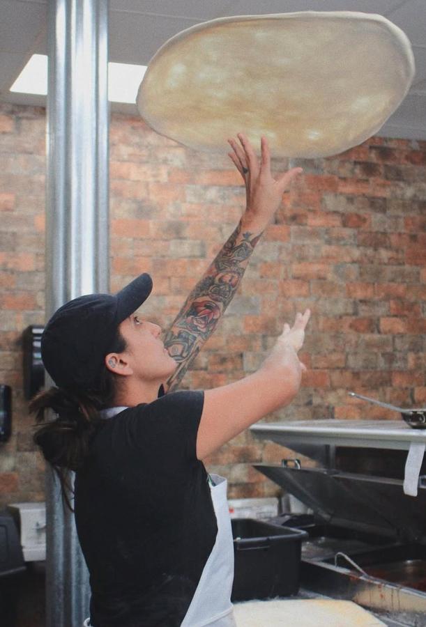 Chef Coley tossing dough